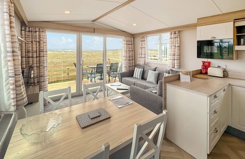 Castle Douglas House | 12ft-wide caravan situated in a coastal position.