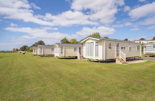 Bridport House | 12ft-wide luxury caravan with one double and two twin.