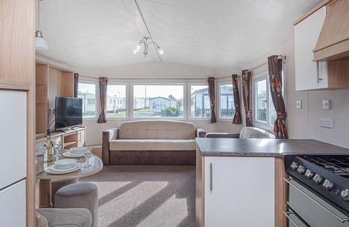 Rhyl House | 12ft-wide quality caravan with one double and two twin.