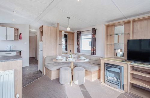 Rhyl House | 12ft-wide quality caravan with one double and two twin.