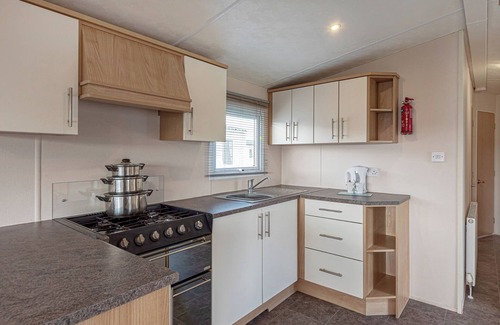 Rhyl House | 12ft-wide quality caravan with one double and two twin.