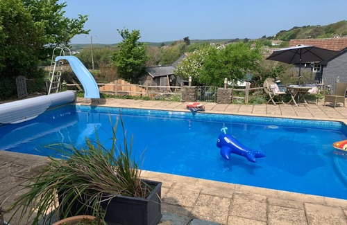 Croyde House | 16th century thatched cottage with swimming pool, driect access onto beach path