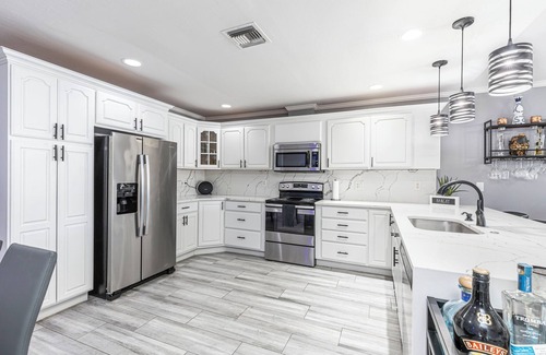 Naples Park House | 2 Pool homes located right next door to each other 7 total bedroom 4 total baths