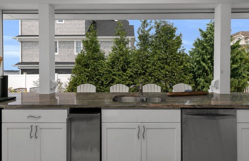Monmouth Beach House | 2023 home on river, across from Beach. Outdoor kitchen bath pool spa fireplace