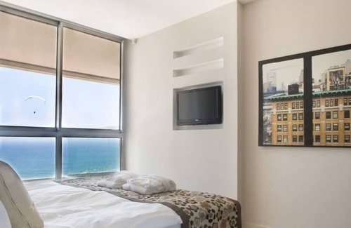 Netanya House | 2BR Suite steps from the beach