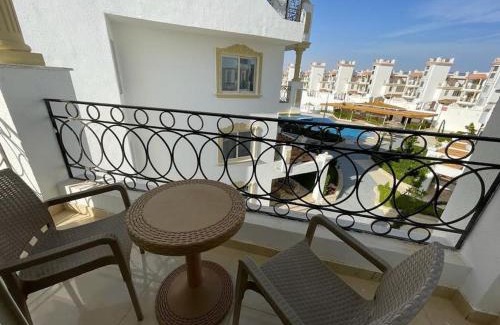 Ras Nasrani Apartment | 3-Bedroom Apartment on the Third Floor with 3 Balconies and lovely Pool View, Street View and Free Beach Access in Sharm Hills Resort