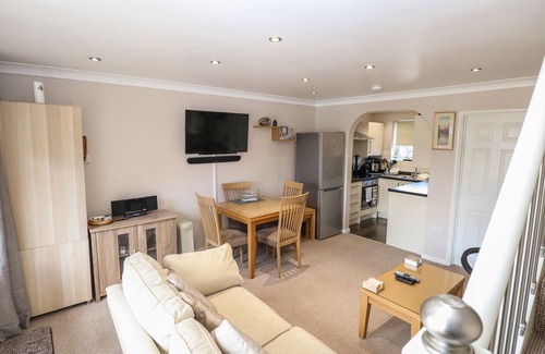 Corton House | 30 THE WATERSIDE HOLIDAY PARK, pet friendly, with a garden in Corton