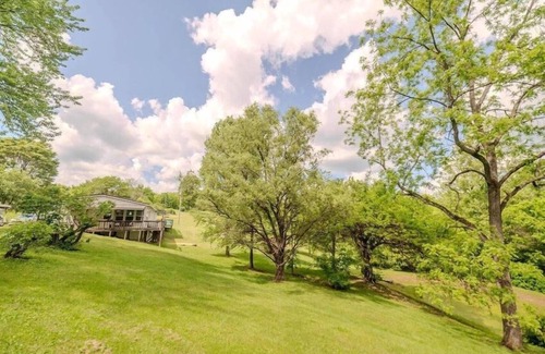 Sharpsburg House | 8700 Wood Rd, Chesterhill, OH - Property with a small cabin and a single family home