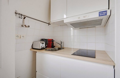 Saint-Vincent-de-Paul Apartment | A Canal St Martin Two Rooms