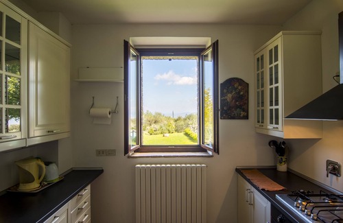 Torgiano Villa | A farmhouse nestled among gardens and olive trees