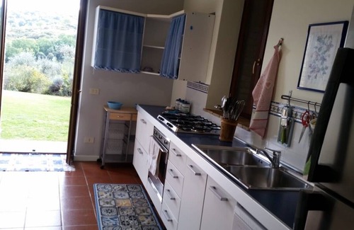 Torgiano Villa | A farmhouse nestled among gardens and olive trees