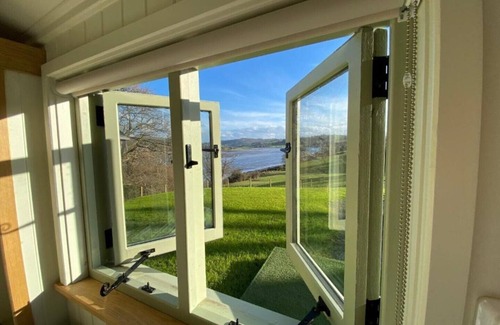Henryd House | A quiet and cosy Shepherds Hut, with wood burning fire with scenic views