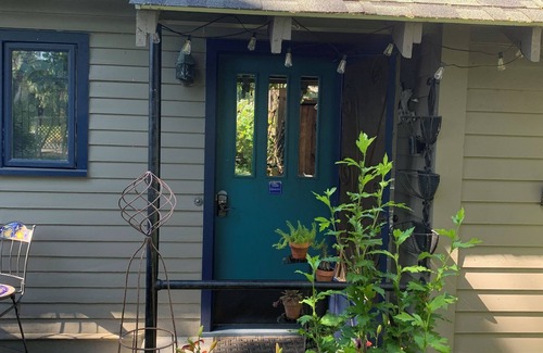 The Dalles Apartment | A shady retreat within a flower garden, with a boutique hotel feel. Close in