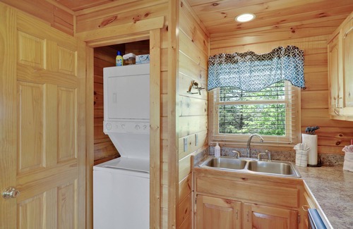 Gatlinburg - Pigeon Forge Cabin | A Taste Of Honey is a dog-friendly two-bedroom true-log cabin nestled inside the Starr Crest resort.