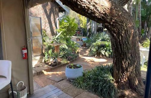 Benoni House | African Paradise - Garden Glamping - Outdoor Shower