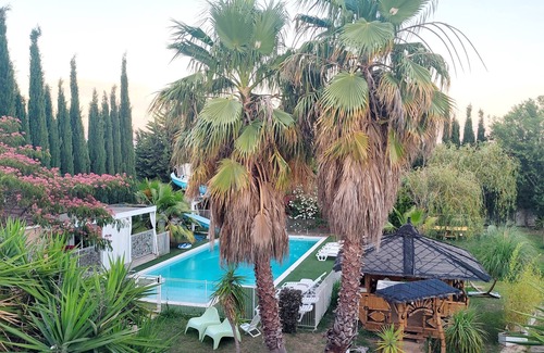 Milhaud Ski Chalet | Air-conditioned 2-bedroom chalet with pool, slide, garden, games.