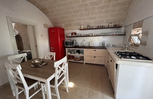 Ostuni Villa | "Al Guappo D'oro," trullo with pool nestled in the Apulian countryside.