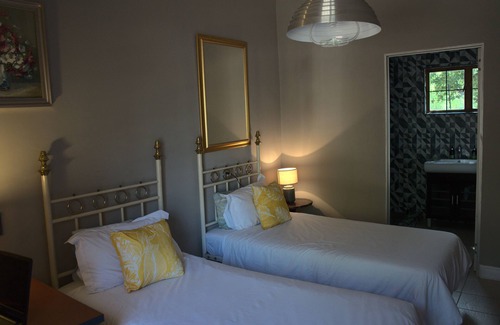 Waterkloof Glen Bed & Breakfast | Aloha Lodge spacious bedroom, sleeps 2, with its own entrance and a garden view