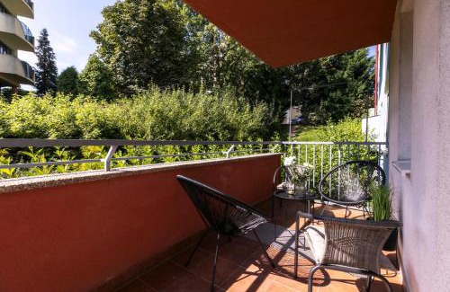 Banska Bystrica Apartment | ALURE RESIDENCES 2 & 24h self check-in, parking in the garage in the apartment building included, new building, terrace, green location with a forest park with a lake, children's playground