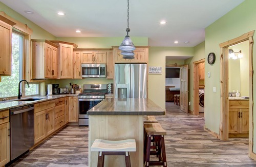 Tainter Lake House | Amazing River House with covered patio! Sleeps 10-14. Kayaks,Fireplace,Games.