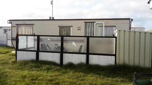 Nes House | AMELAND-Nes-Duinoord: Stacaravan (chalet) + fietsen direct aan zee!