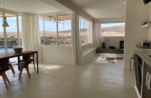 Lajares Villa | An architectural oasis with large swimming pool, along a breath-taking scenery.