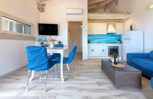 Trinita d'Agultu e Vignola Apartment | Apartment 'Borgo Del Mare 1' with Sea View, Private Pool and Air Conditioning