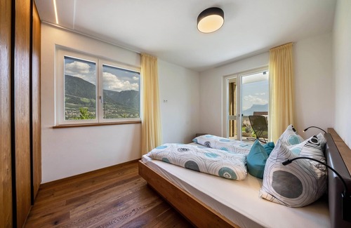 Tirolo Apartment | Apartment 'Pataunerhof Sambuca Lodge' with Mountain View, Shared Pool & Wi-Fi