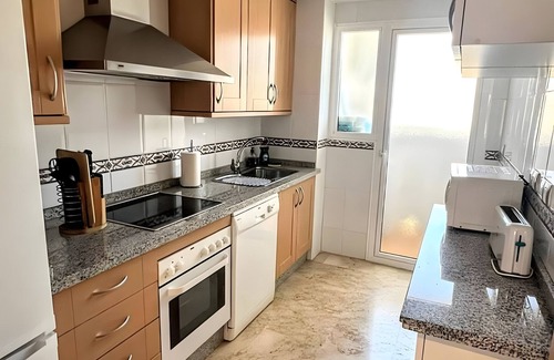 San Luis de Sabinillas Apartment | Apartment 'Residencial Duquesa' with Shared Pool, Wi-Fi and Air Conditioning