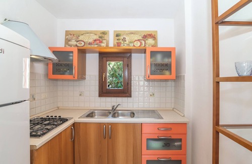 Porto San Paolo Apartment | Apartment 'Tavolara Porto San Paolo E2' with Sea View, Shared Pool and Air Conditioning