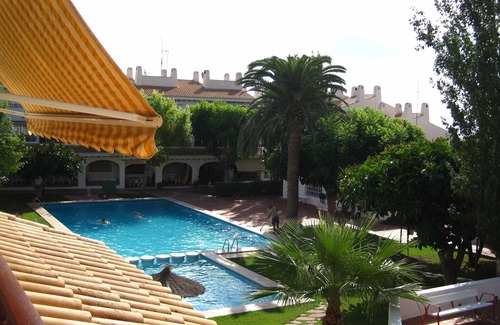 Coveta Fuma Apartment | Apt in lush gardens, large pool, steps from the sea, stroll to Campello beach
