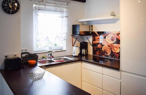 Rowy House | Attractive holiday home in Rowy with fireplace and garden
