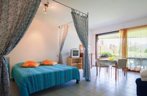 Susello Apartment | Attractive studio with terrace and garden, pool and dream view