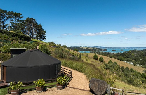 Palm Beach Cabin | Awaawa Yurts - Tane Yurt - Awaawa Yurts offer a luxury glamping experience on Waiheke Island. Stunning views, luxury queen sized bed, private bathroom with tea and coffee making facilities.