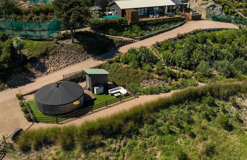 Palm Beach Cabin | Awaawa Yurts - Tane Yurt - Awaawa Yurts offer a luxury glamping experience on Waiheke Island. Stunning views, luxury queen sized bed, private bathroom with tea and coffee making facilities.
