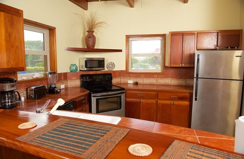 San Pedro Villa | Be right on the beach with a designer pool and your own tennis/pickleball court!