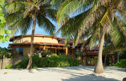 San Pedro Villa | Be right on the beach with a designer pool and your own tennis/pickleball court!
