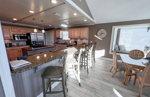 Holiday Isle Villa | BEACH BOATING PARADISE-Heated Pool, 2 King Suites,90FT Boat Dock,Game Room,Bikes