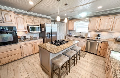 Holiday Isle Villa | BEACH BOATING PARADISE-Heated Pool, 2 King Suites,90FT Boat Dock,Game Room,Bikes