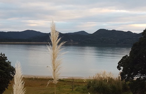 Kennedy Bay House | Beach, Bush, Birdsong and stunningly Beautiful views...with a touch of luxury.