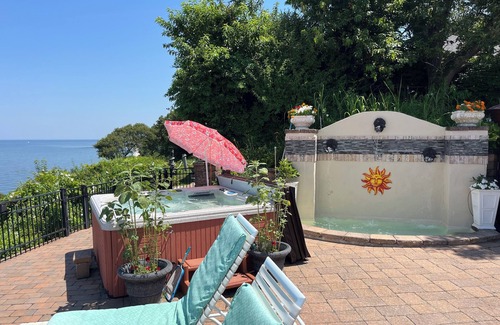 Long Island House | Beach front house amazing views 3/3, 8 person spa covered granite wet bar 55” TV