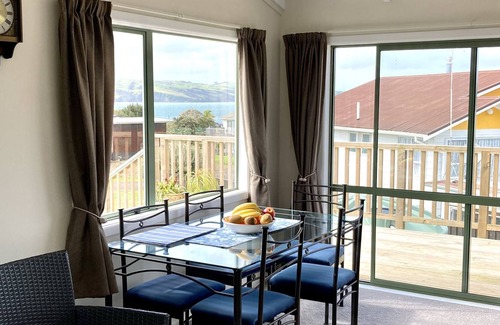 Tinopai Cottage | Beach house getaway for the Family. 2 minutes away from water's edge.