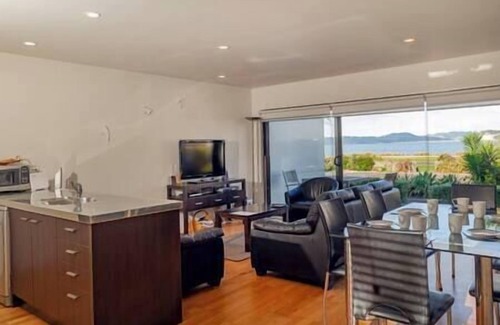Whitianga Apartment | Beach views from apartment at Aqua Soleil complex with lap pool & spa.