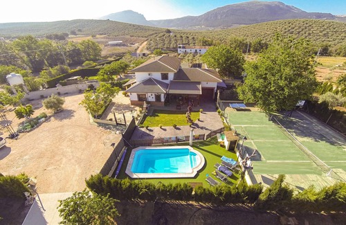 Villanueva del Trabuco House | Beautiful and spacious semi-detached house with heated outdoor pool and solar panels.