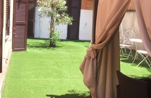 Vatican Apartment | Beautiful double bedroom with garden