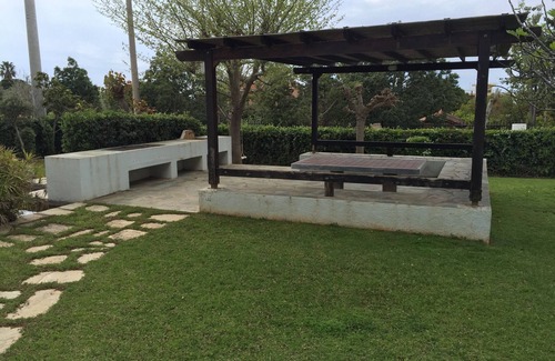 Saronida Apartment | Beautiful Garden With Gazebo Walking Distance To the Sea