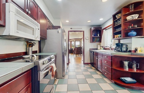 Indianola House | Beautiful home with foosball table, waterfront views, fireplace, basketball cour