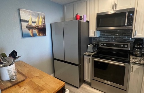 Thomas Drive Condo | Beautiful Lagoon-View Condo – 1BR + Loft in Gated Community, 5-Min Walk to Beach