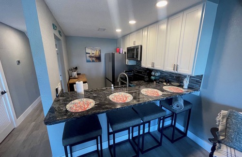 Thomas Drive Condo | Beautiful Lagoon-View Condo – 1BR + Loft in Gated Community, 5-Min Walk to Beach