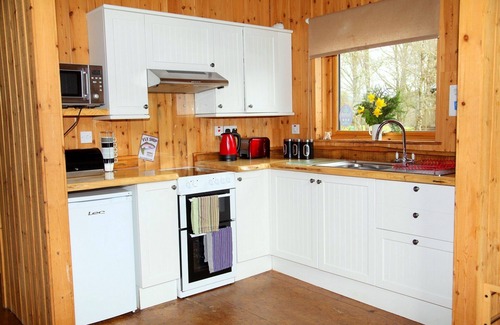 Dallavich Cabin | BRACKEN is a beautiful log cabin with lovely outlook over open meadow.